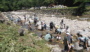 Playing along river near camping site